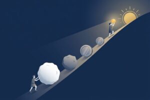 uma pessoa empurrando uma bola de neve ladeira acima, representando o processo de sair das dívidas aos poucos